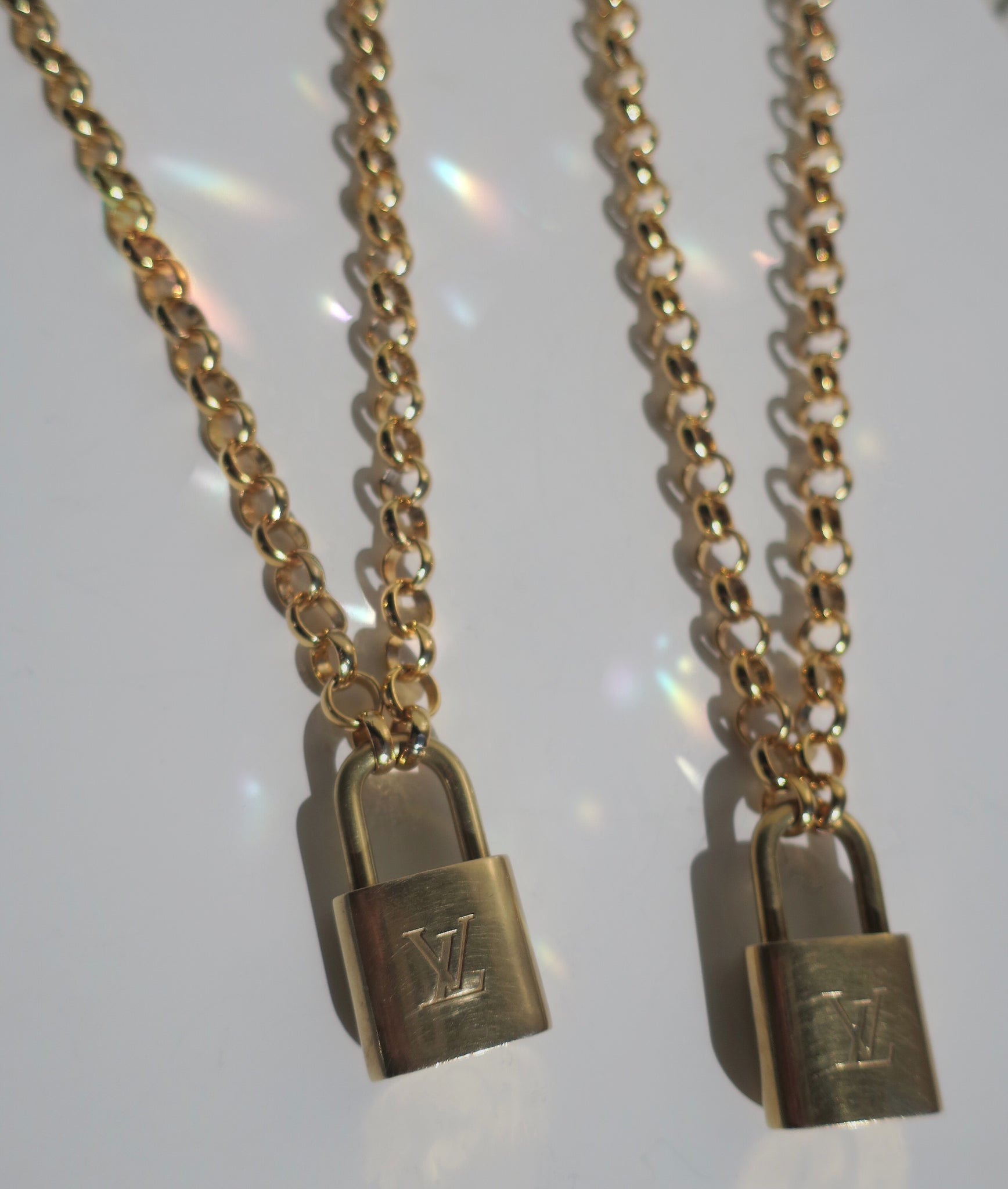 Repurposed vintage brass Louis Vuitton padlock 311 with layered style  necklace chains
